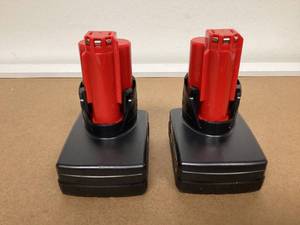 lot 573 image: LOT OF 2 Milwaukee M12 XC High Capacity 3.0 AH REDLITHIUM Battery (48-11-2402)