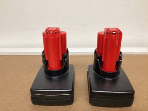 lot 574 image: LOT OF 2 Milwaukee M12 XC High Capacity 3.0 AH REDLITHIUM Battery (48-11-2402)