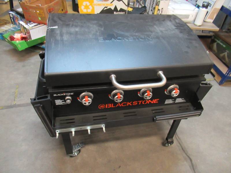 lot 105 image: Blackstone 36in. Griddle with Hood & Front Shelf - Costco Exclusive - Minor Scratches  Minimal USE