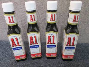 lot 528 image: 4- 5 oz A1 Original Sauce Best Date...