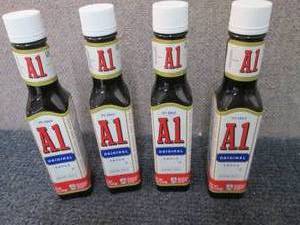 lot 529 image: 4- 5 oz A1 Original Sauce Best Date...