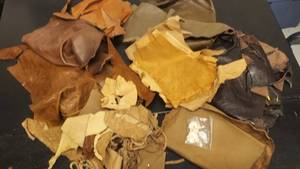 lot 58 image: Leather Remnants and 2 Skull Buttons