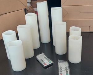 lot 105 image: 9 LED Flameless Paraffin Coated Candles