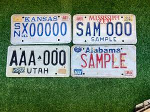 lot 79 image: Sample License Plates - Kansas, Mississippi, Utah & Alabama