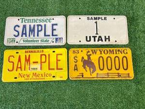 lot 84 image: Sample License Plates - Tennessee, Utah, New Mexico & Wyoming