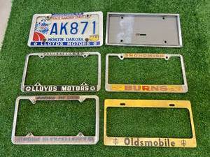 lot 162 image: License Plate Covers - Oldsmobile is Brass