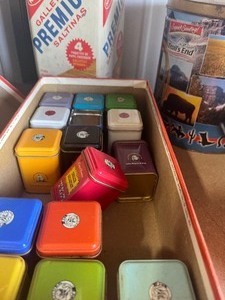 Saltine tin  and bunch of small tins