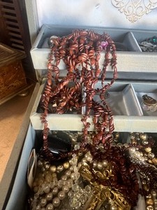2 jewelry boxes with some costume jewelry