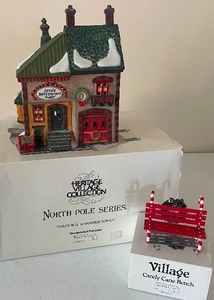 lot 36 image: Retired Dept. 56 Heritage Village Co. North Pole Series Orlys Bells and Harness Supply with a Candy Cane Bench original boxes