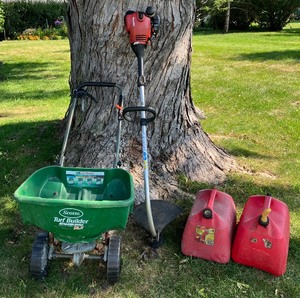 lot 62 image: Lawncare LOT -Homelite Gas Weed Trimmer, Seed Spreader, Three Gas Cans
