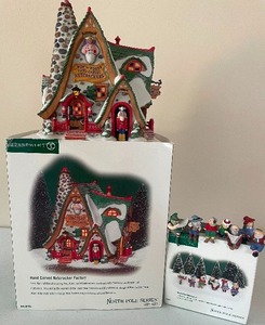 lot 11 image: Retired Dept. 56 North Pole Series Hand Carved Nutcracker Factory and Have a Seat Elves North Pole Series No Lights
