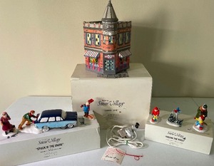 lot 226 image: Corner Cafe Dept. 56 The Original Snow Village with Stuck in the Snow and Feeding the Birds
