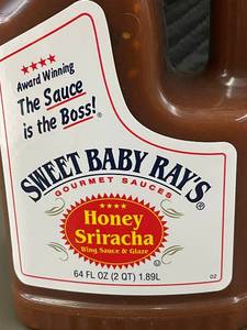 lot 49 image: Lot of 2 Sweet Baby Rays Honey Sriracha Wing Sauce & Glaze 64 Fl Oz