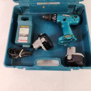 lot 38 image: Makita 6233D Drill Charger And Two Batteries Hard Case