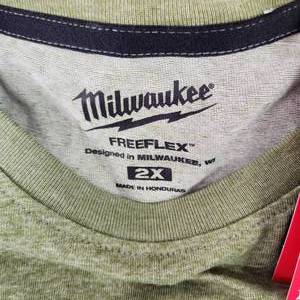 lot 66 image: Two Carhart Short Sleeve Tees GreenBlack One Long Sleeve Black Tee