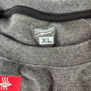 lot 71 image: Lot Of Two Milwaukee NWT T-Shirts Gray Is Long Sleeve Charcoal Is Short Sleeve Size XL