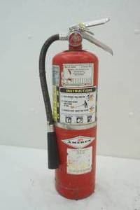 Filled, recharged fire extinguisher