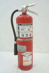 Filled, recharged fire extinguisher