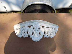 Ornate White Wall Shelf with Intricate Leaf Design
