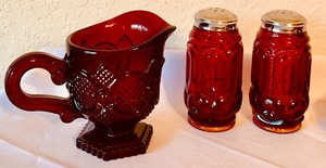 lot 261 image: Variety of Vintage Ruby Red Dishes Including Avon 1876 Cape Cod Collection Ruby Red Glass Creamer and Candle Holders