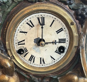 lot 343 image: Antique Walton Clothiers Metal Novelty Clock with Cherub Accents