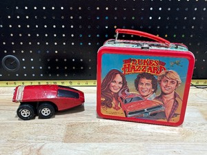 lot 28 image: Dukes of Hazzard Lunchbox and 1970 Tonka Red Scorcher