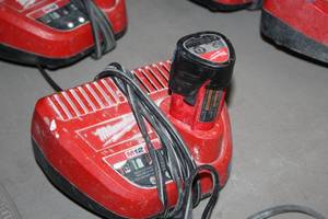 lot 394 image: Milwaukee M12 Battery Charger with Battery
