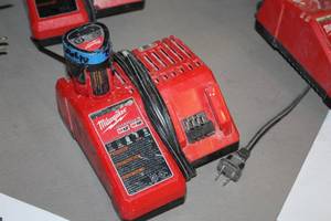 lot 398 image: Milwaukee M12M18 Battery Charger with M12 Red Lithium Battery