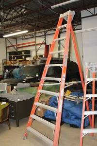 lot 9 image: Louisville Ladder 300-lbs 10 Corner Step Ladder FT1510