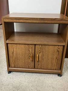lot 32 image: Wooden Rolling Cabinet with Storage