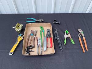 lot 10 image: Assorted Hand Tool Lot Including Pliers, Pipe Wrench, and Utility Knife