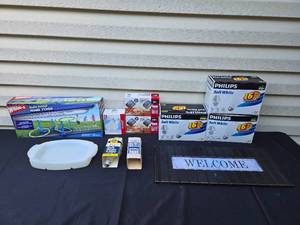 lot 397 image: Lot of Mixed Household Items Including Phillips Soft White Bulbs, Wham-O Hula Hoop Ring Toss, and More