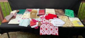 lot 301 image: Lot of Assorted Tablecloths, Napkins, and Kitchen Towels