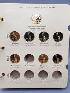 lot 267 image: PROOF US Innovation Dollars in 3-Ring Album--8 Coins