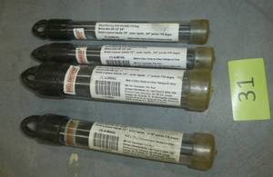 lot 31 image: 4 larger drill bits, only the 1 inch looks used
