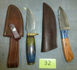 lot 32 image: Two knives with leather sheath