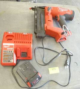 lot 115 image: Milwaukee 18ga brad nailer with battery and charger