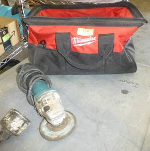 lot 140 image: Makita cut off tool and milwaukee bag