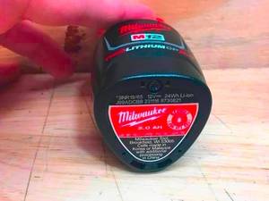 lot 51 image: Lot of 2 - Milwaukee M12 Red Lithium 2Ah Battery Model # 44-11-2420 (Retail $64.97 Each)