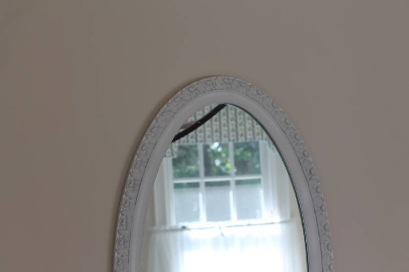 lot 32 image: Floral Upholstered Armchair and White Oval Wall Mirror