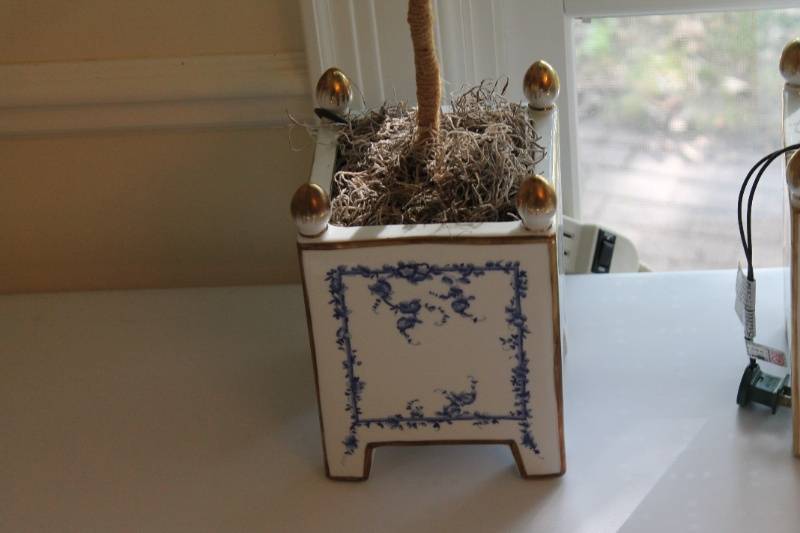 lot 34 image: Pair of Faux Topiary Trees with Decorative Planters