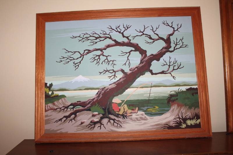 lot 98 image: Lot of 2 Framed Paintings - Fisherman Under Tree and Village Scene