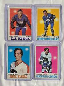lot 318 image: Lot of 4 Vintage Topps Hockey Cards Andre Lacroix #84, Andre Boudrias #121, Eddie Shack #35, George Armstrong #113