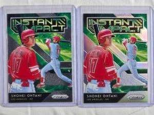 lot 48 image: Lot of 2 Shohei Ohtani 2019 Panini Instant Impact Prizm & Base #11-4 Los Angeles Angels