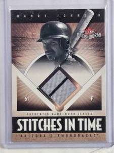 lot 141 image: Randy Johnson 2004 Fleer Stitches in Time Relic #ST-RJ Numbered 168350 - Arizona Diamondbacks