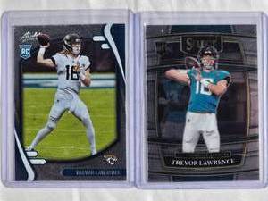 lot 251 image: Lot of 2 Trevor Lawrence Rookie Cards 2021 Panini Select #43 & 2021 Panini Absolute #101