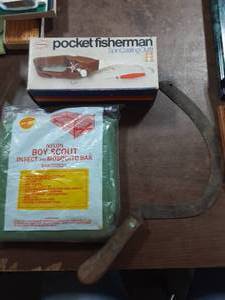 lot 14 image: Popeils Pocket Fisherman (Like New), Boy Scout Net For Cot, Hand Scythe
