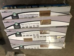 lot 30 image: Pallet with 8 cases TrafficMaster Ardenmore Oak 6 MIL x 7 in. W x 48 in. L Waterproof Click Lock Vinyl Plank Flooring (23.8 sq.ft.Case) customer return see pictures