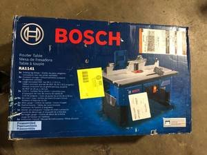 lot 47 image: Bosch 26 in. x 16.5 in. Laminated MDF Top Portable Jobsite Router Table with 2-12 in. Vacuum Hose Port customer return see pictures