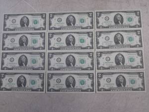 lot 8 image: (CNTR) 12 Uncirculated $2 Bills...